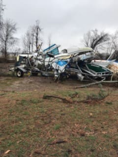 Boats piled up after the tornado at DSA.